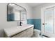 Stylish bathroom with blue tile and updated vanity at 5215 Dover Ne St, St Petersburg, FL 33703
