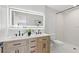 Modern bathroom with double vanity and walk-in shower at 5215 Dover Ne St, St Petersburg, FL 33703
