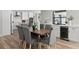 Modern dining room with a wood table and gray chairs at 5215 Dover Ne St, St Petersburg, FL 33703