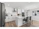 Modern white kitchen with stainless steel appliances and island at 5215 Dover Ne St, St Petersburg, FL 33703