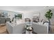 Bright and airy living room featuring modern sofas and a view at 5215 Dover Ne St, St Petersburg, FL 33703