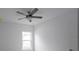 Spacious bedroom with ceiling fan and window at 573 Rose Apple Cir, Port Charlotte, FL 33954