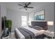Spacious bedroom with a large bed, window, and ceiling fan at 573 Rose Apple Cir, Port Charlotte, FL 33954