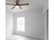 Charming bedroom with ceiling fan and large window at 573 Rose Apple Cir, Port Charlotte, FL 33954