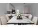 Elegant dining room with large marble table and seating at 573 Rose Apple Cir, Port Charlotte, FL 33954