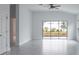 Bright living room with tile floors and view of backyard at 573 Rose Apple Cir, Port Charlotte, FL 33954