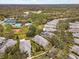 Aerial view of community with pool and tennis courts at 5742 Heronpark Pl, Lithia, FL 33547