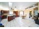 Open concept kitchen with island and dining area at 5815 114Th N Ter, Pinellas Park, FL 33782