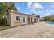 Pool area with a small building and brick pavers at 5860 Fishhawk Ridge Dr, Lithia, FL 33547