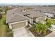 Two-story home with a two-car garage and landscaping at 6320 Cliveden Ct, Apollo Beach, FL 33572