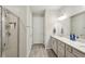 Bathroom boasts double vanity, large mirror and shower at 6320 Cliveden Ct, Apollo Beach, FL 33572