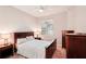 Bright bedroom with a double bed, nightstands, and dresser at 6320 Cliveden Ct, Apollo Beach, FL 33572