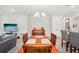 Bright dining room with wood table and view of living area at 6320 Cliveden Ct, Apollo Beach, FL 33572
