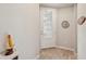 Inviting entryway with a white door and wood-look tile floor at 6320 Cliveden Ct, Apollo Beach, FL 33572