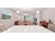 Open kitchen with white cabinets, an island, and views to living room at 6320 Cliveden Ct, Apollo Beach, FL 33572
