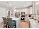 Modern kitchen with white cabinets, stainless steel appliances, and an island at 6320 Cliveden Ct, Apollo Beach, FL 33572