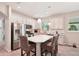 Modern kitchen with white cabinets, stainless steel appliances, and island at 6320 Cliveden Ct, Apollo Beach, FL 33572