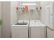 Laundry room with washer, dryer, and shelving at 6320 Cliveden Ct, Apollo Beach, FL 33572