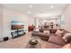 Open living room showcasing a sectional sofa and kitchen views at 6320 Cliveden Ct, Apollo Beach, FL 33572