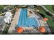 Community pool with lounge chairs and umbrellas at 6320 Cliveden Ct, Apollo Beach, FL 33572