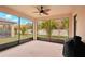 Relaxing screened porch with backyard view and ceiling fan at 6320 Cliveden Ct, Apollo Beach, FL 33572