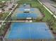 Aerial view of community sports courts, including basketball and tennis courts at 6320 Cliveden Ct, Apollo Beach, FL 33572