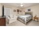 Bedroom with ceiling fan and comfortable seating area at 804 67Th W St, Bradenton, FL 34209