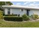 Side view of a light blue house with well-maintained landscaping at 804 67Th W St, Bradenton, FL 34209