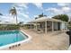 Community pool with covered seating and tables at 804 67Th W St, Bradenton, FL 34209