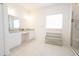 Bathroom with double vanity and large shower at 8203 Abalone Loop, Parrish, FL 34219