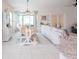 Farmhouse style dining area with a large wooden table and bench seating at 8203 Abalone Loop, Parrish, FL 34219