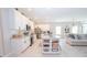 Modern kitchen boasting white cabinets, granite counters, and stainless steel appliances at 8203 Abalone Loop, Parrish, FL 34219