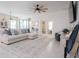 Spacious living room with a sectional sofa and large area rug at 8203 Abalone Loop, Parrish, FL 34219