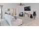 Bright living room featuring comfy seating and a large TV at 8203 Abalone Loop, Parrish, FL 34219