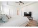 Main bedroom with king-size bed and large TV at 8203 Abalone Loop, Parrish, FL 34219