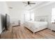 Spacious main bedroom with king-size bed and wood floors at 8203 Abalone Loop, Parrish, FL 34219