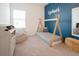 Cozy ' room with teepee bed and blue accent wall at 8203 Abalone Loop, Parrish, FL 34219