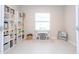 Organized ' room with built-in shelving and a study area at 8203 Abalone Loop, Parrish, FL 34219