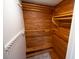 Spacious cedar closet with built-in shelves and hanging rods at 8300 Woodsong Row, Hudson, FL 34667