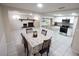 Bright dining area with kitchen and fireplace views at 8300 Woodsong Row, Hudson, FL 34667