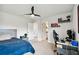 Bedroom with a desk setup, gaming chair and built-in shelving at 8368 Greenway Ave, Wesley Chapel, FL 33544