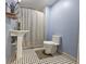 Clean bathroom with pedestal sink and black and white tile floor at 908 N Gordon St, Plant City, FL 33563