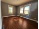 Simple bedroom with gray walls and laminate wood flooring at 908 N Gordon St, Plant City, FL 33563