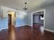 Spacious dining room with hardwood floors and a chandelier at 908 N Gordon St, Plant City, FL 33563