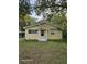 Charming yellow house with a well-maintained lawn at 908 N Gordon St, Plant City, FL 33563