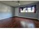 Bright living room with hardwood floors and a ceiling fan at 908 N Gordon St, Plant City, FL 33563