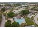 Aerial view showing community pool, playground, and surrounding homes at 915 Burlwood St, Brandon, FL 33511