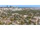 Stunning aerial view of a neighborhood with lush green trees and downtown city skyline in the background at 979 11Th S Ave, St Petersburg, FL 33705