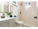 Bathroom featuring a stylish vanity and walk-in shower with modern fixtures at 979 11Th S Ave, St Petersburg, FL 33705