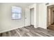 This cozy bedroom features modern floors, a window, and a closet for storage at 979 11Th S Ave, St Petersburg, FL 33705